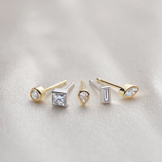 Stud earrings with diamond and gemstone