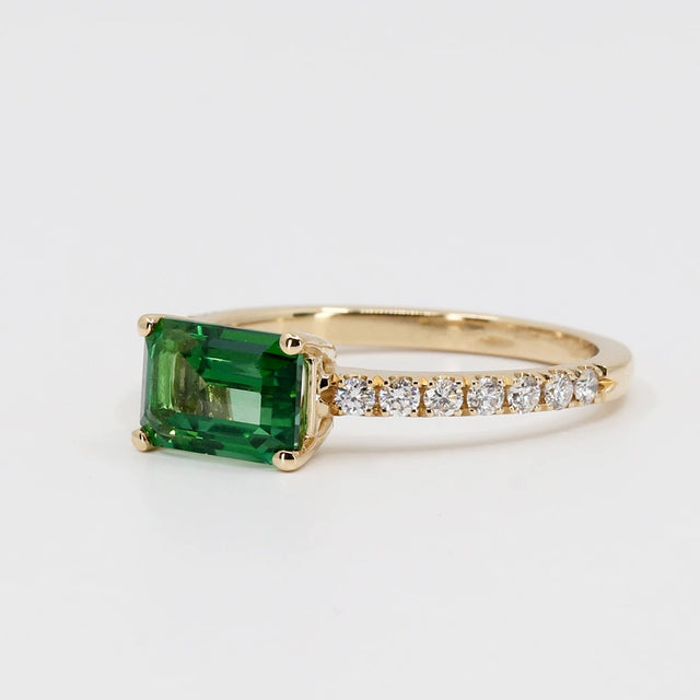 Yellow gold ring with deep green topaz and diamonds